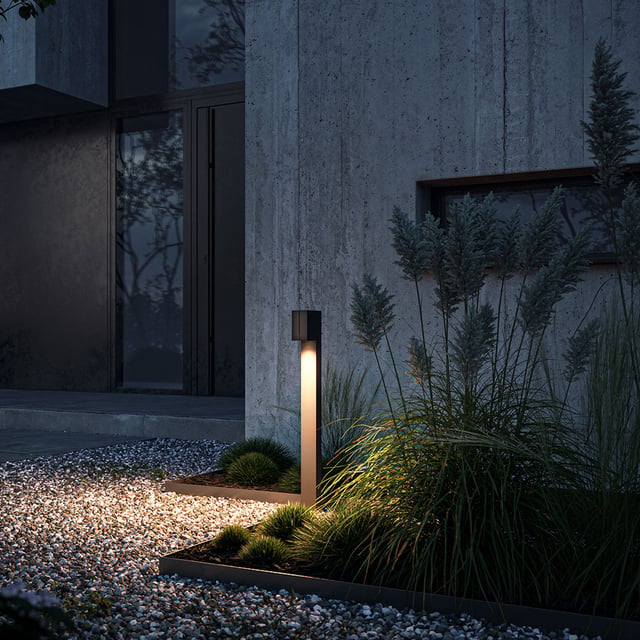 Warm bollard lighting against a cool evening garden
